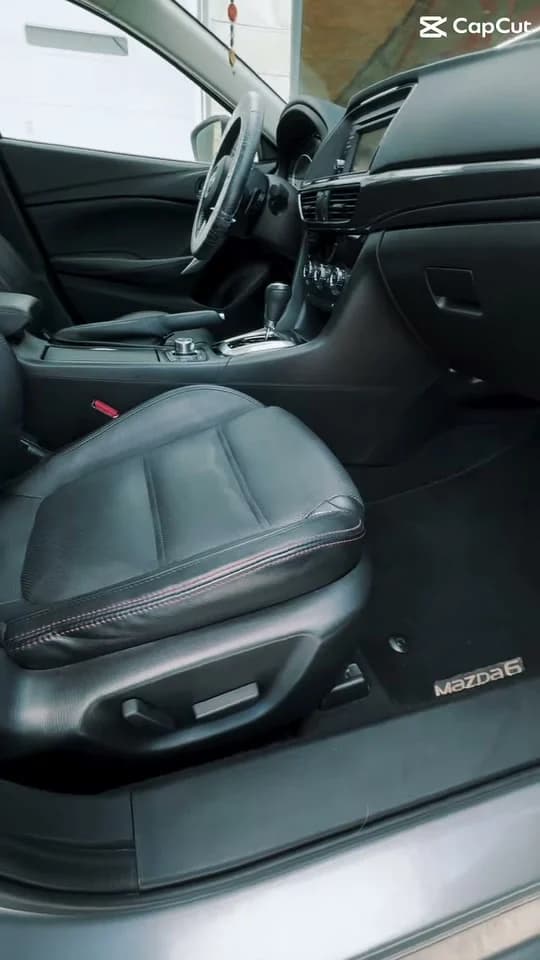 Clean black leather Mazda front seat and cabin