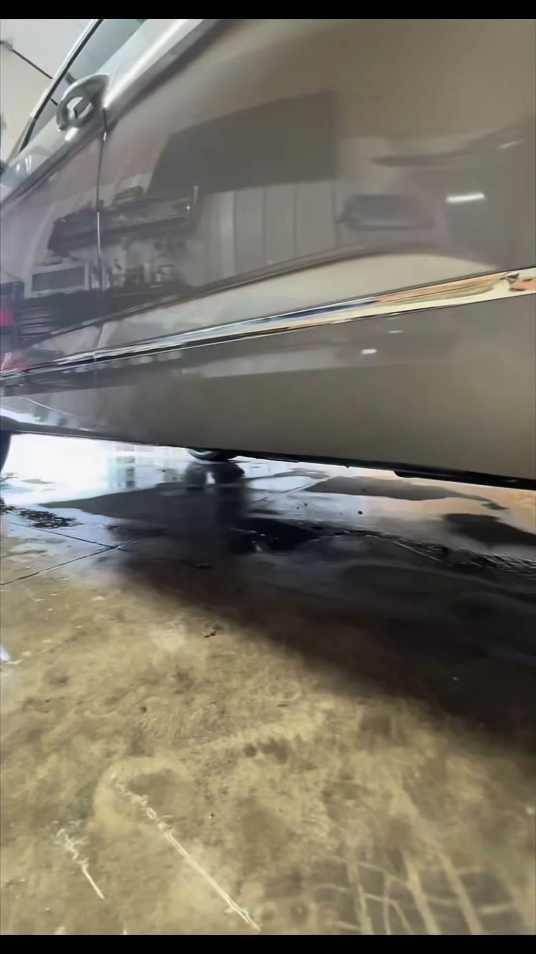 Silver SUV lower panel after tar removal
